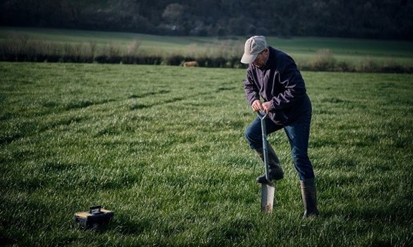 Farmer digging at Whitewool Farm